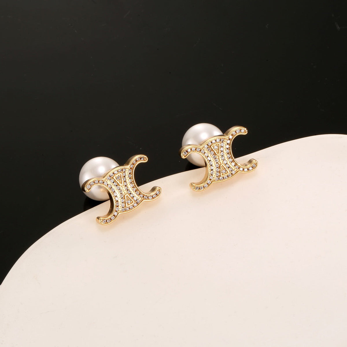 Martin Graham stud earrings in polished metal-tone