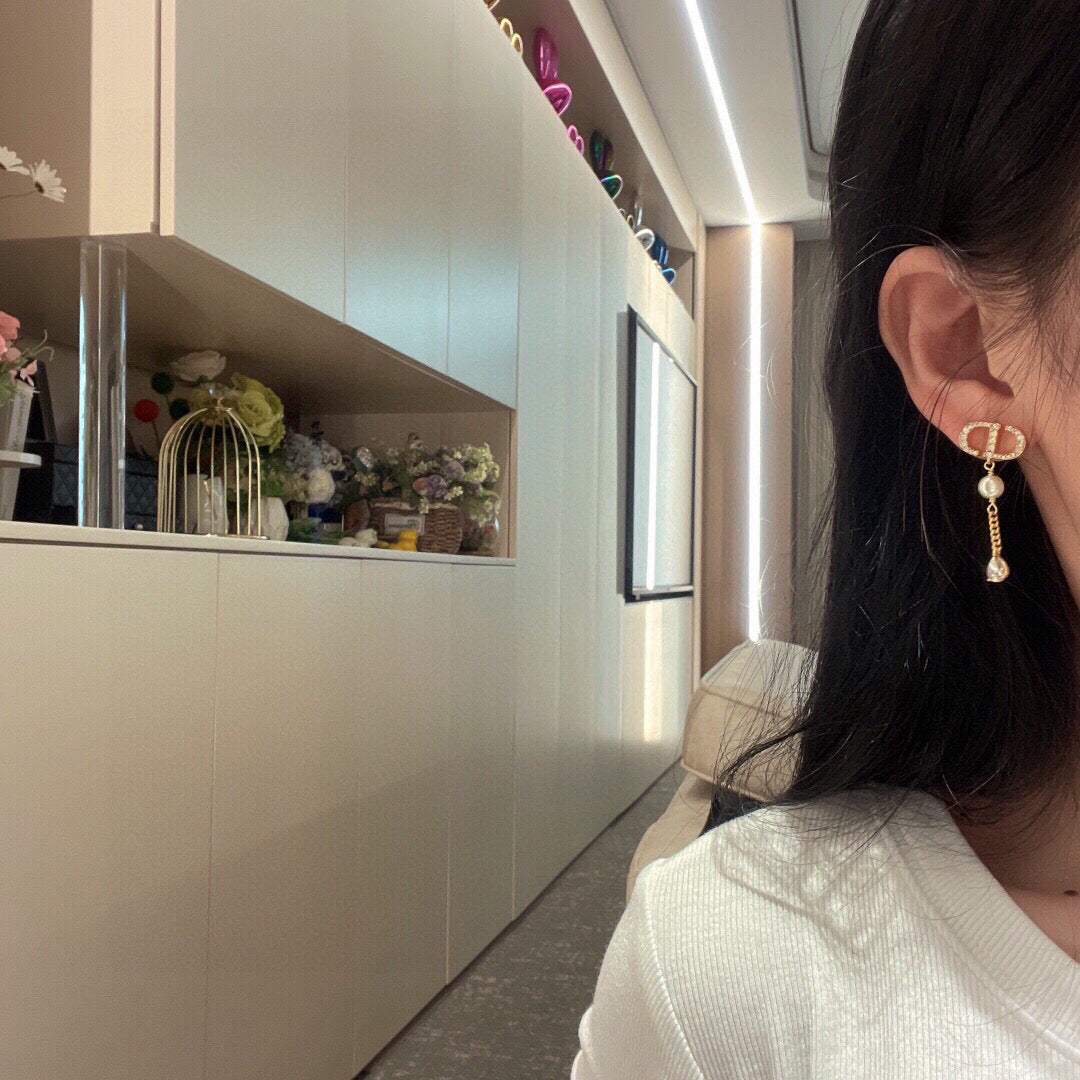Martin Graham stud earrings in polished metal-tone