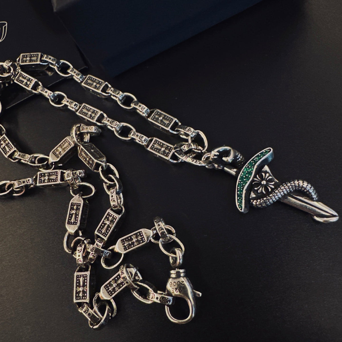 Martin Graham pendant necklace in polished metal-tone – close-up detail