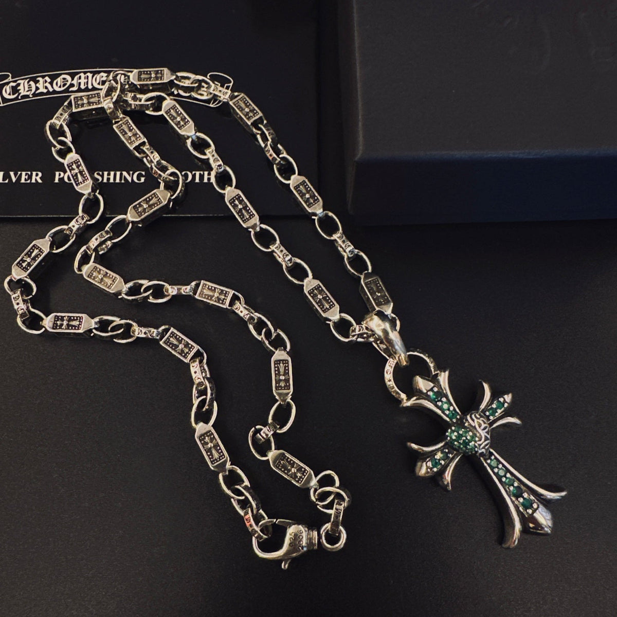 Martin Graham pendant necklace in polished metal-tone – close-up detail