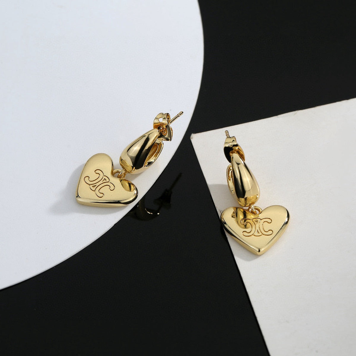 Martin Graham stud earrings in polished metal-tone