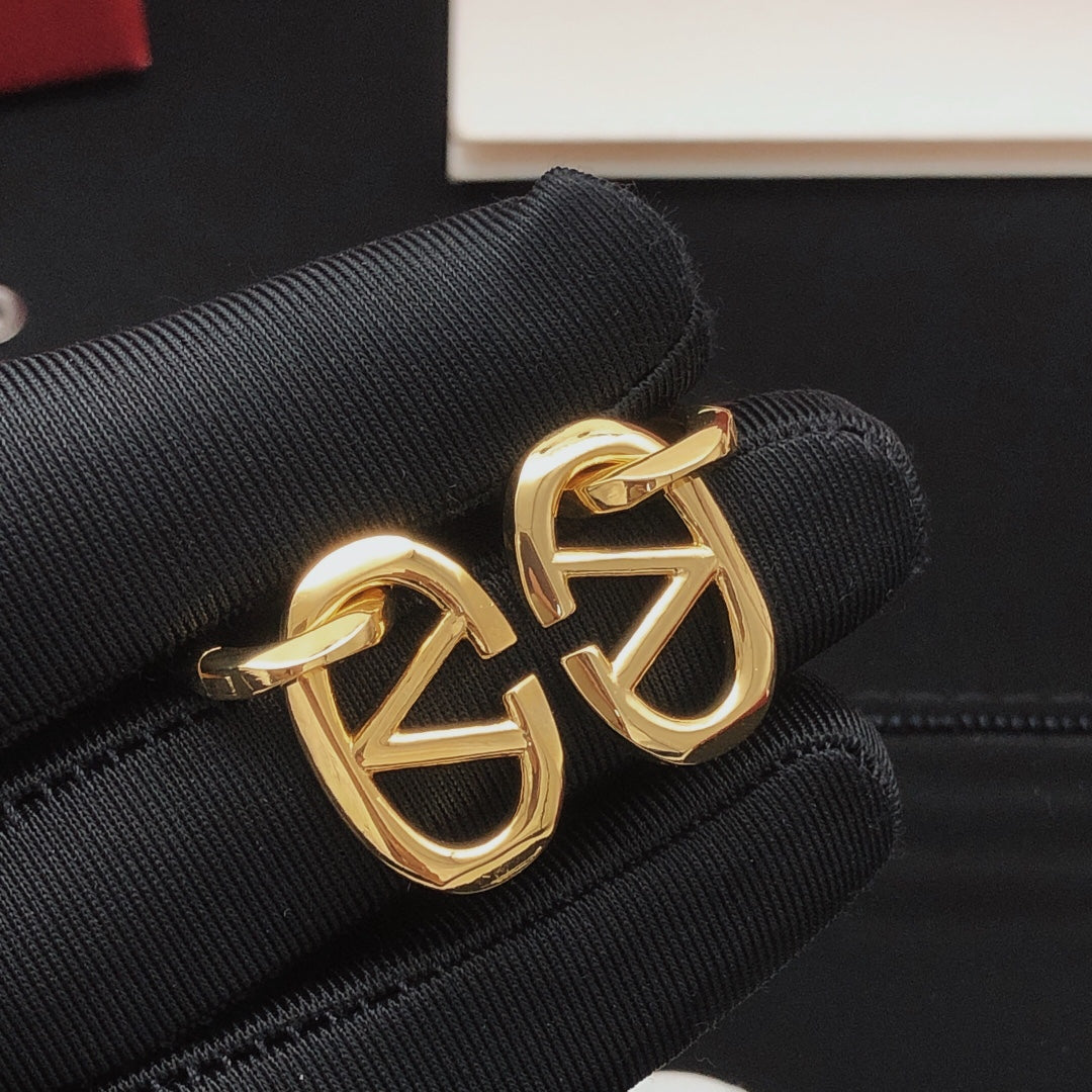 Martin Graham drop earrings in polished metal-tone