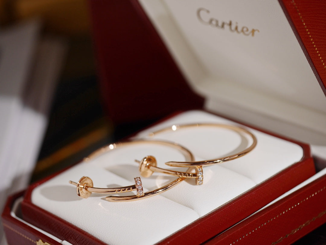 Martin Graham earrings in polished metal-tone