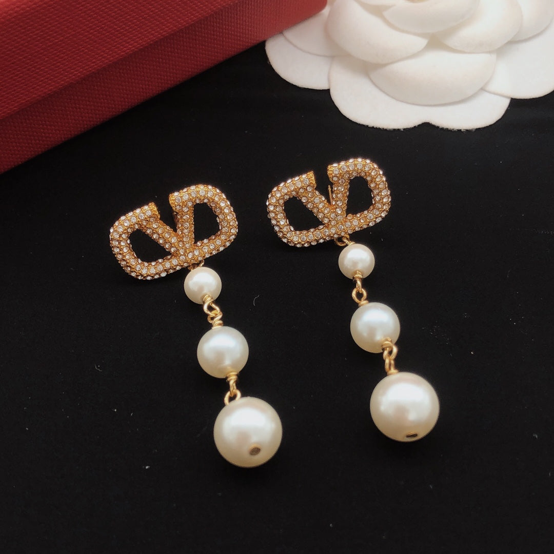 Martin Graham stud earrings in polished metal-tone