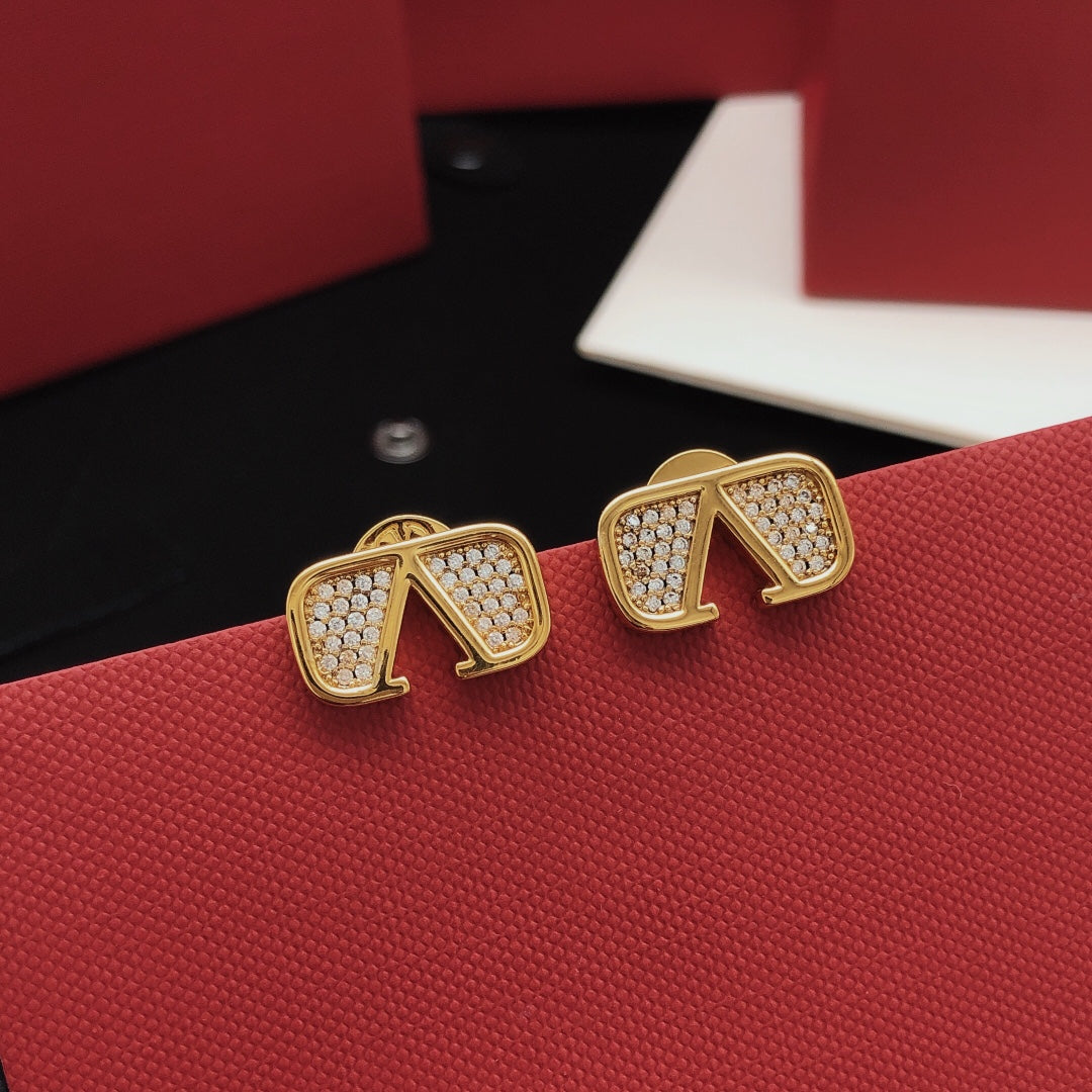 Martin Graham stud earrings in polished metal-tone