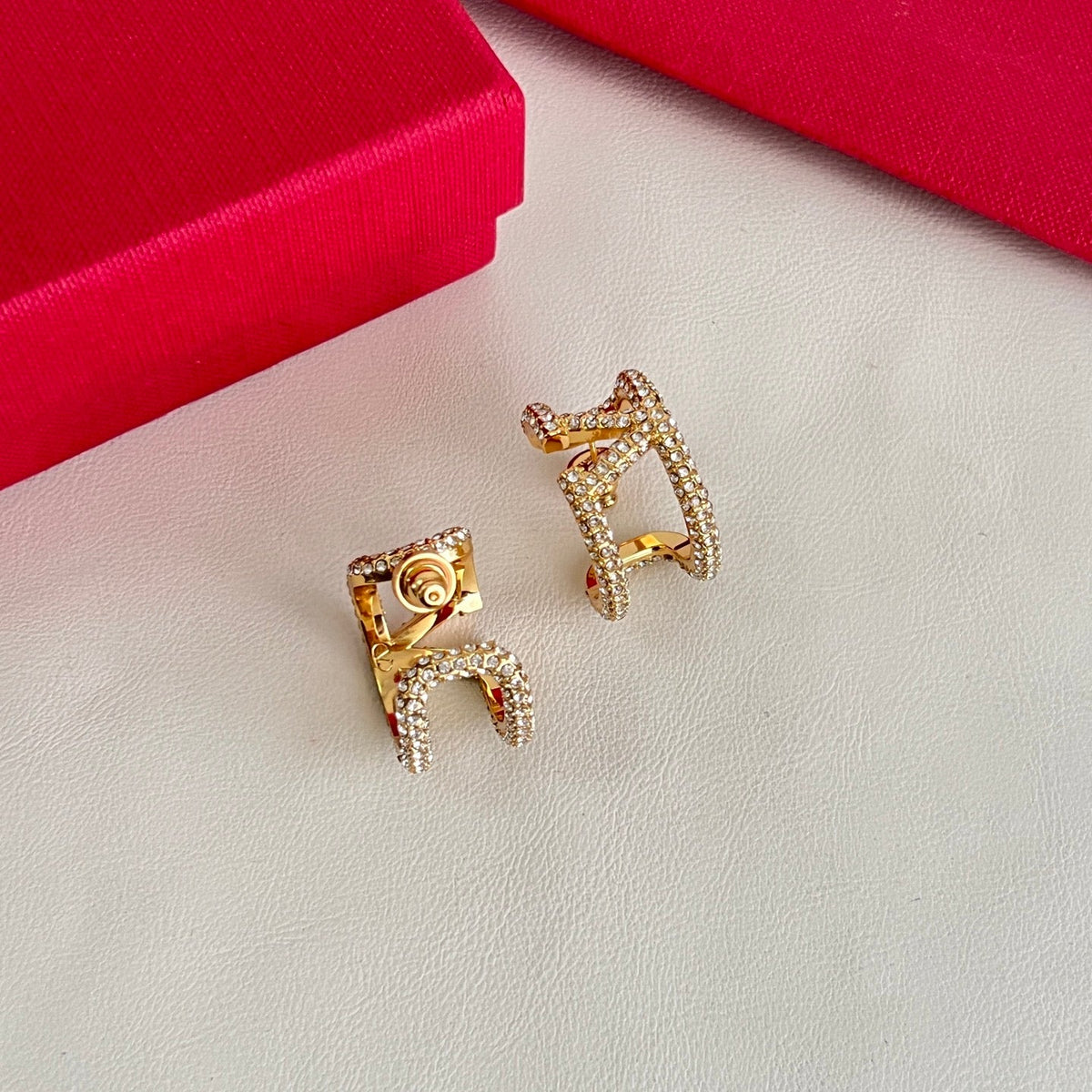 Martin Graham earrings in polished metal-tone
