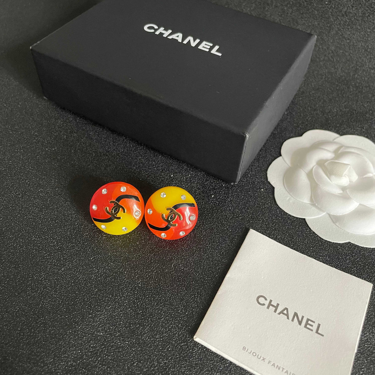 Martin Graham stud earrings in polished metal-tone – close-up detail