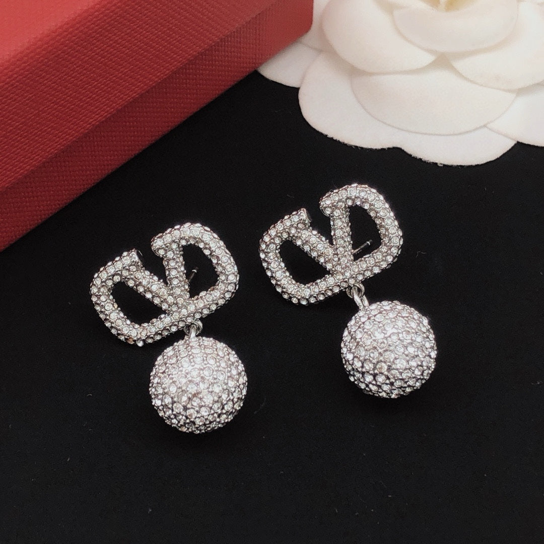 Martin Graham stud earrings in polished metal-tone