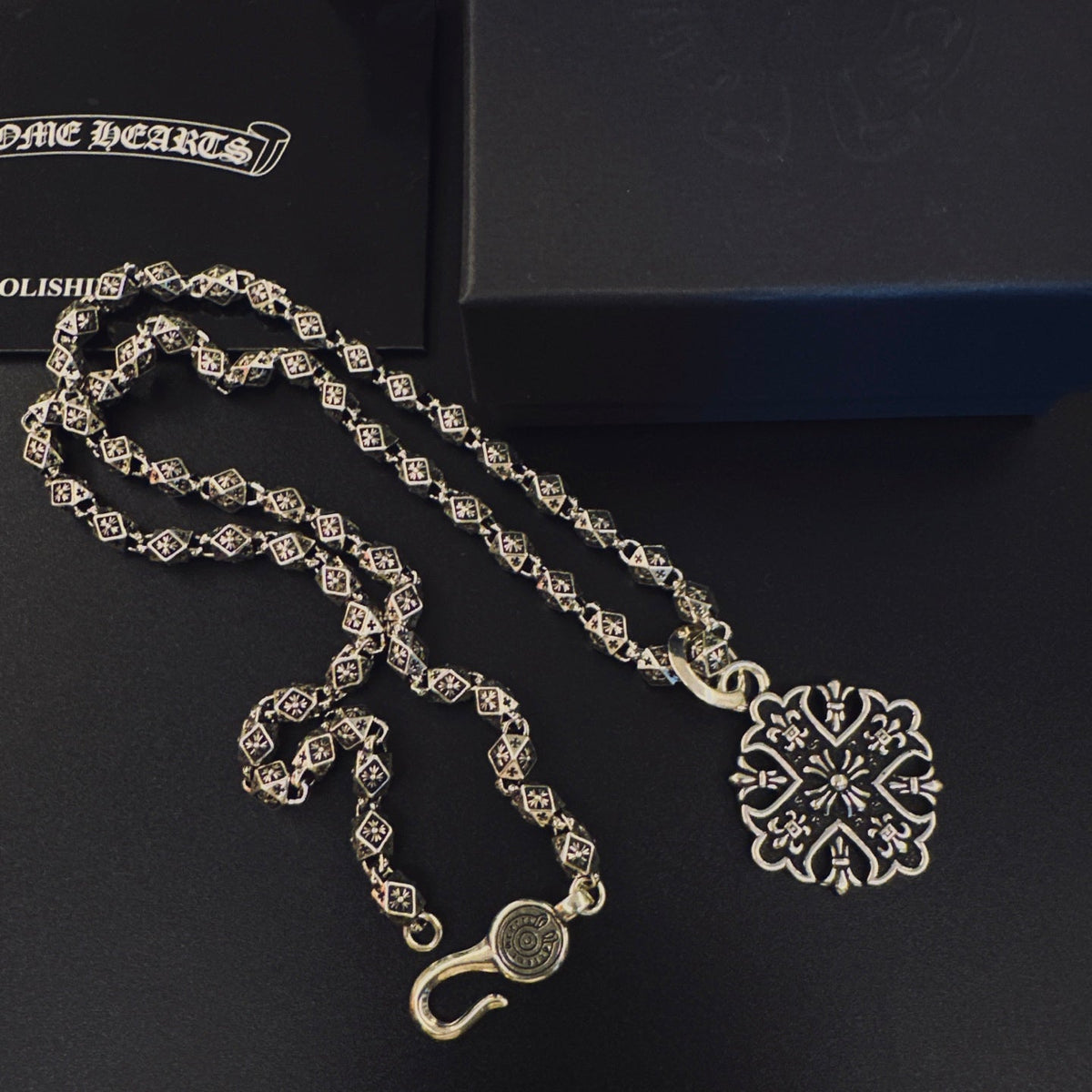 Martin Graham pendant necklace in polished metal-tone – close-up detail