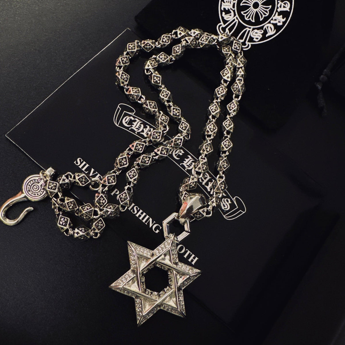 Martin Graham pendant necklace in polished metal-tone – close-up detail
