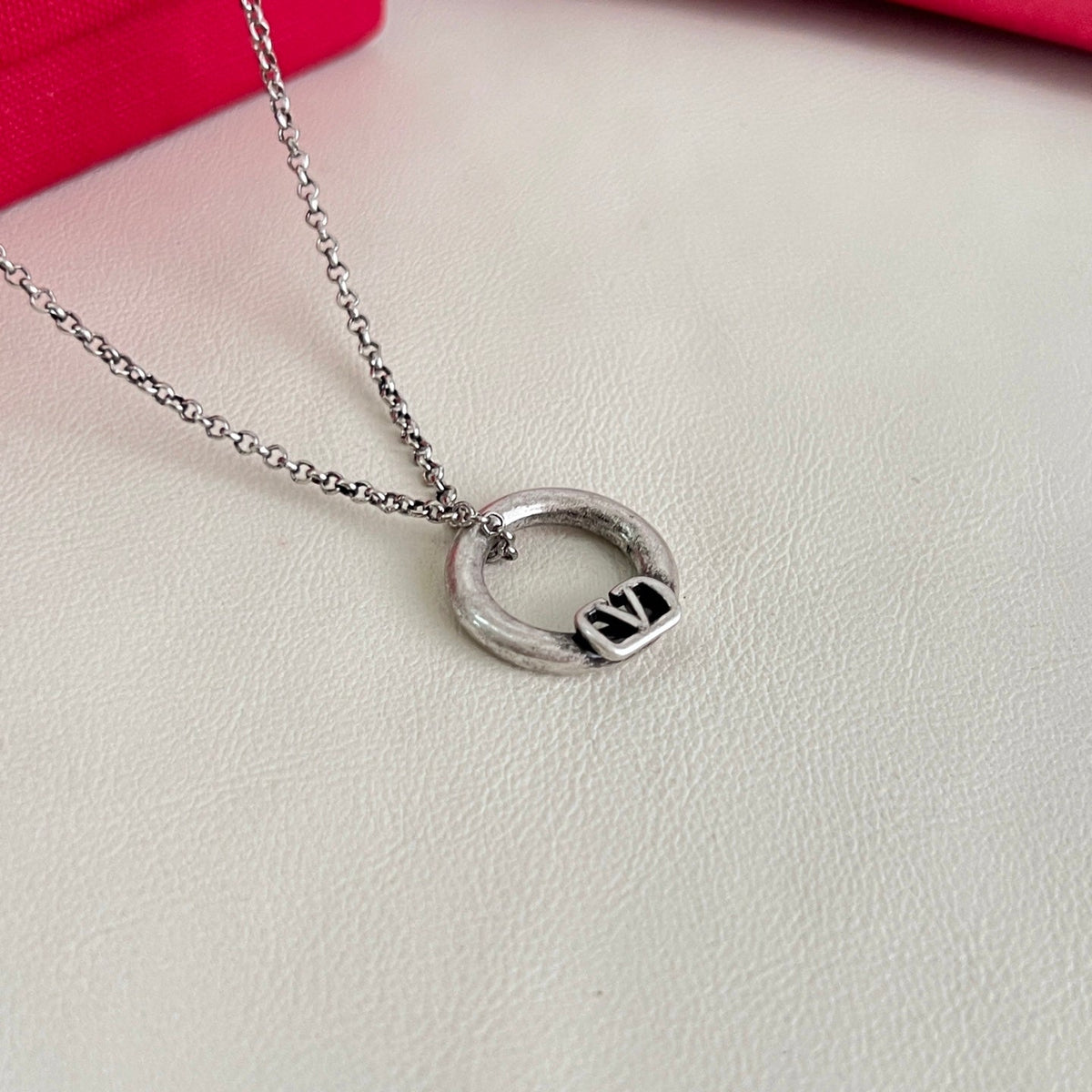 Martin Graham pendant necklace in polished metal-tone