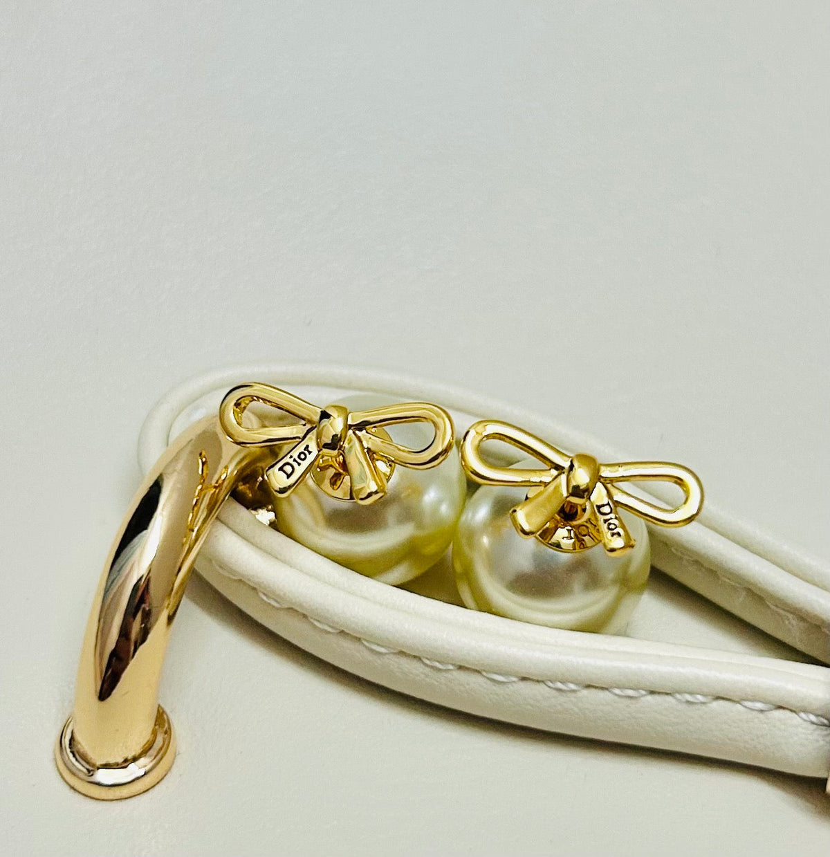 Martin Graham earrings in polished metal-tone