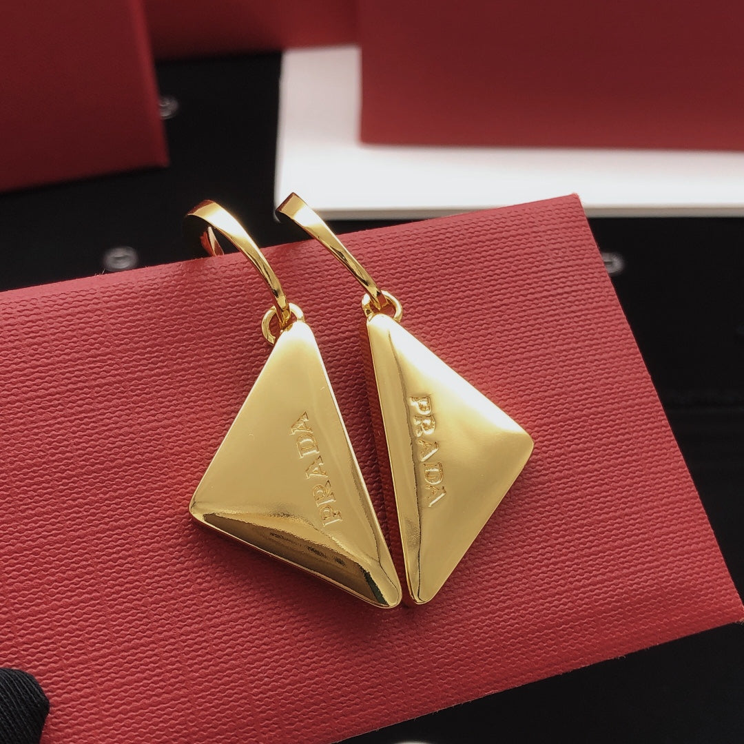 Martin Graham drop earrings in polished metal-tone
