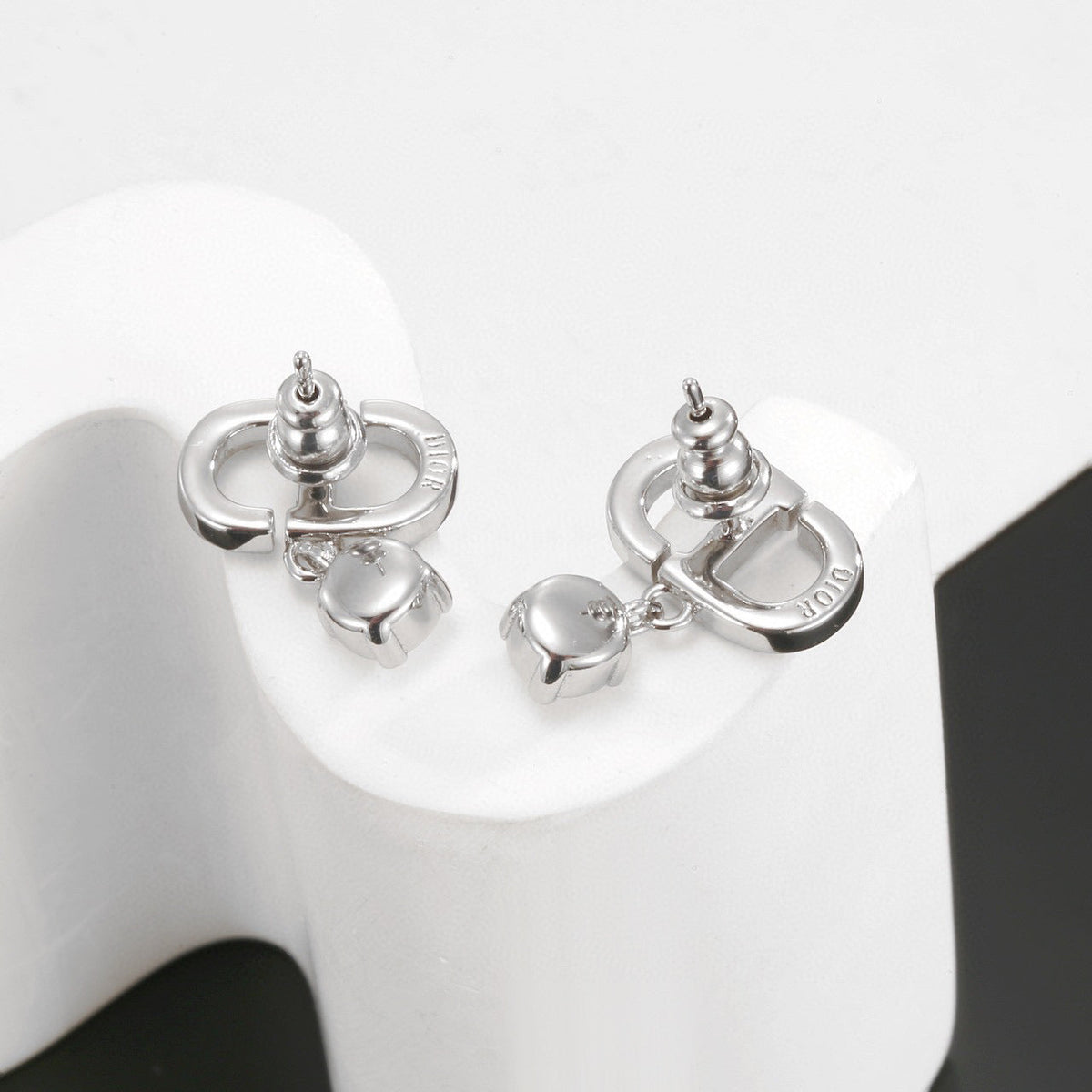 Martin Graham stud earrings in polished metal-tone