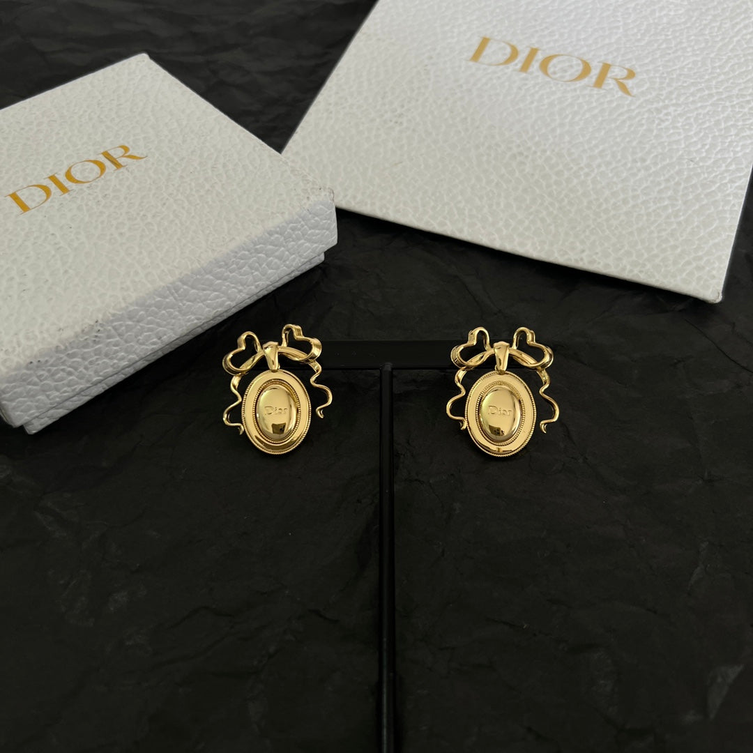 Martin Graham stud earrings in polished metal-tone