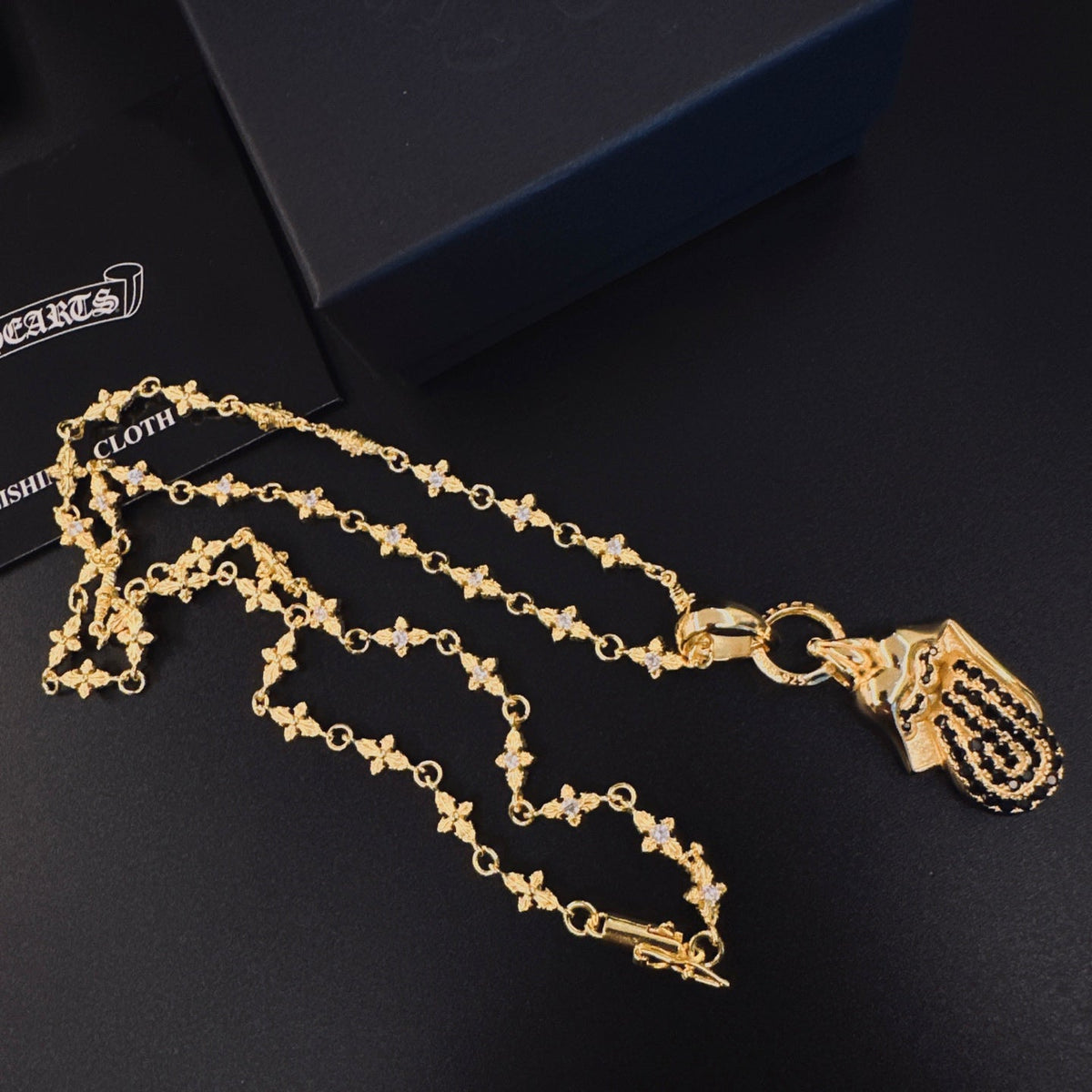 Martin Graham pendant necklace in polished metal-tone – close-up detail