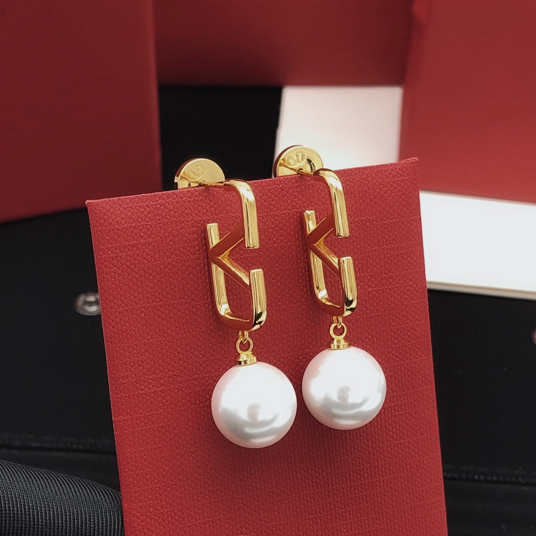 Martin Graham stud earrings in polished metal-tone