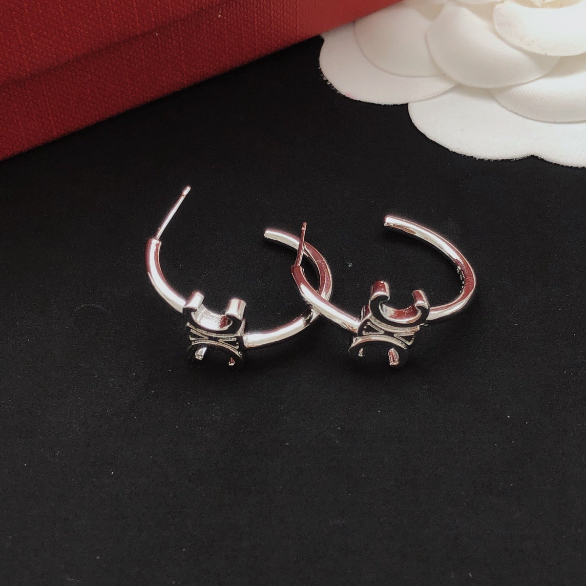 Martin Graham drop earrings in polished metal-tone