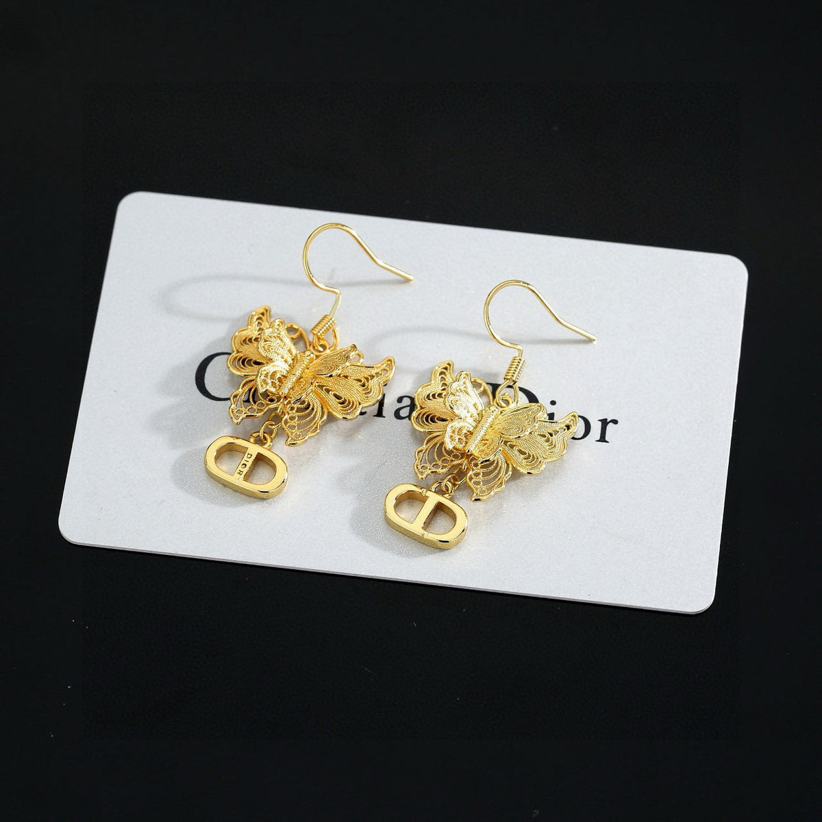 Martin Graham stud earrings in polished metal-tone