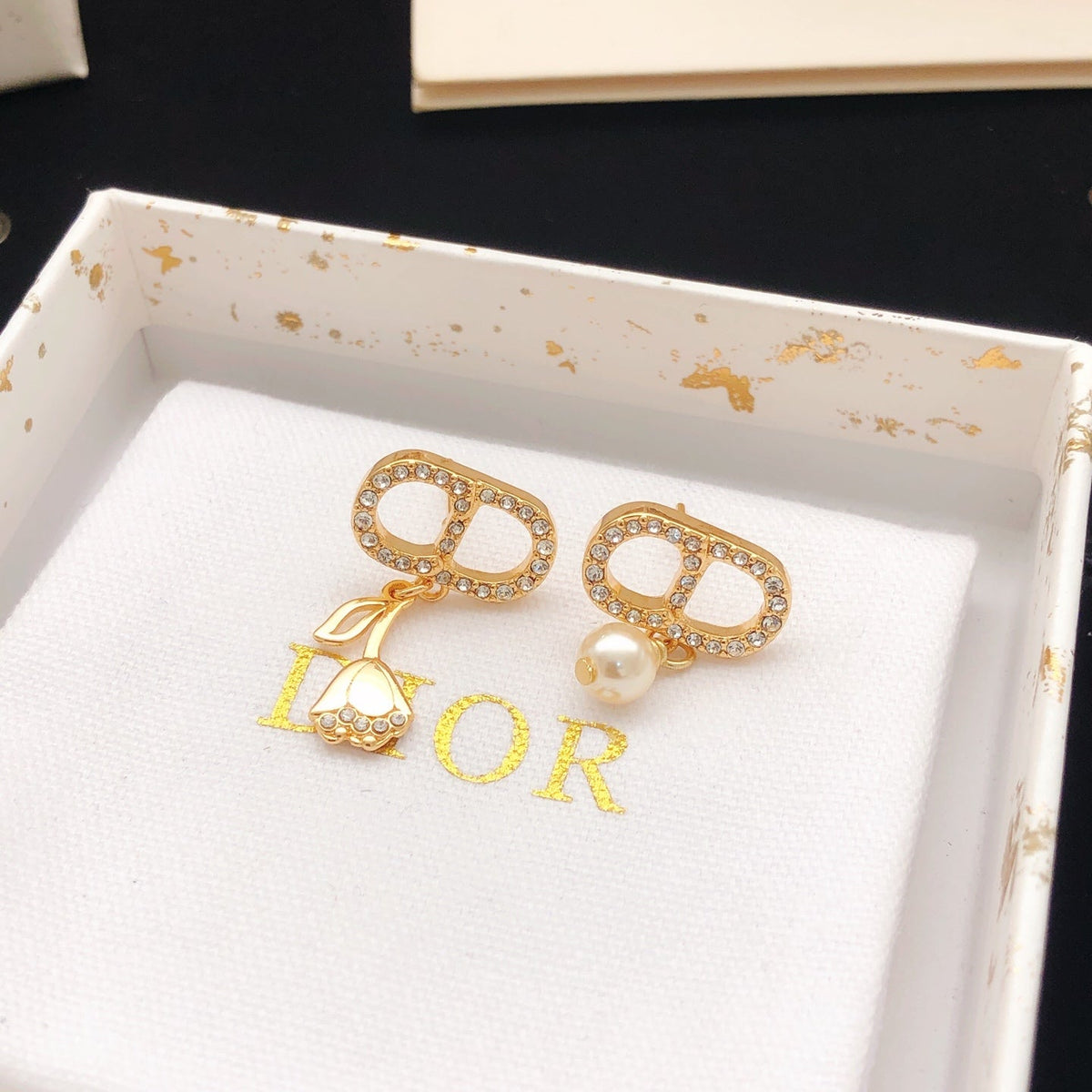 Martin Graham stud earrings in polished metal-tone