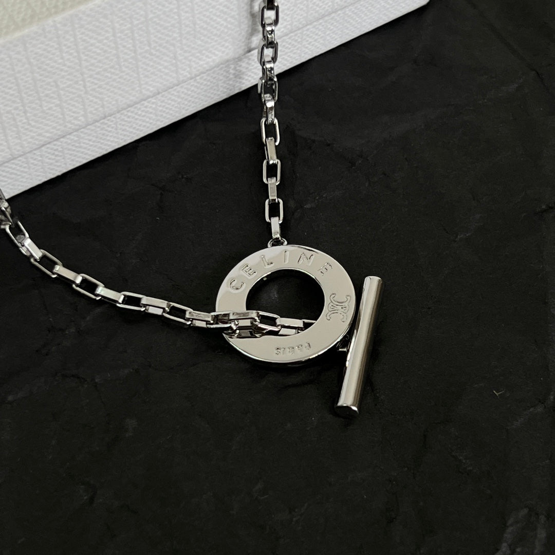 Martin Graham pendant necklace in polished metal-tone