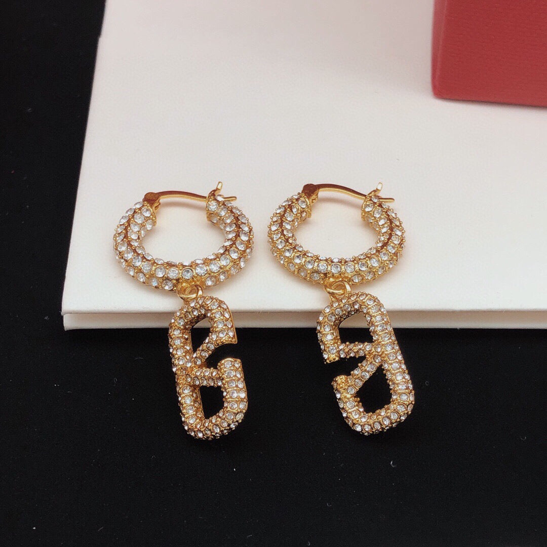 Martin Graham drop earrings in polished metal-tone