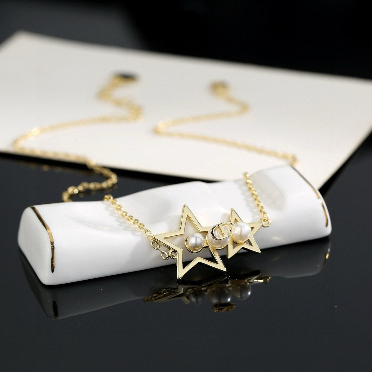 Martin Graham pendant necklace in polished metal-tone