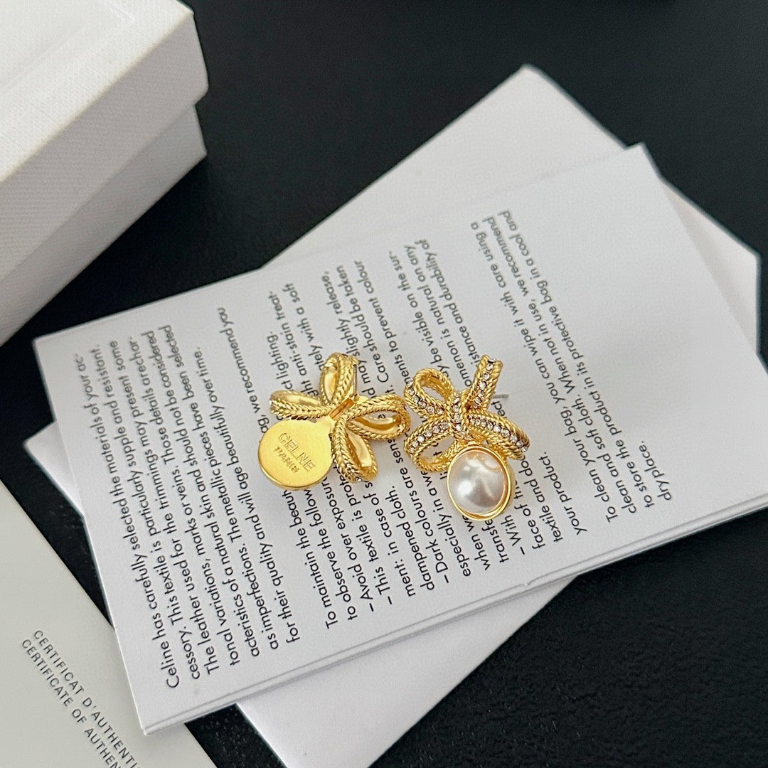 Martin Graham stud earrings in polished metal-tone