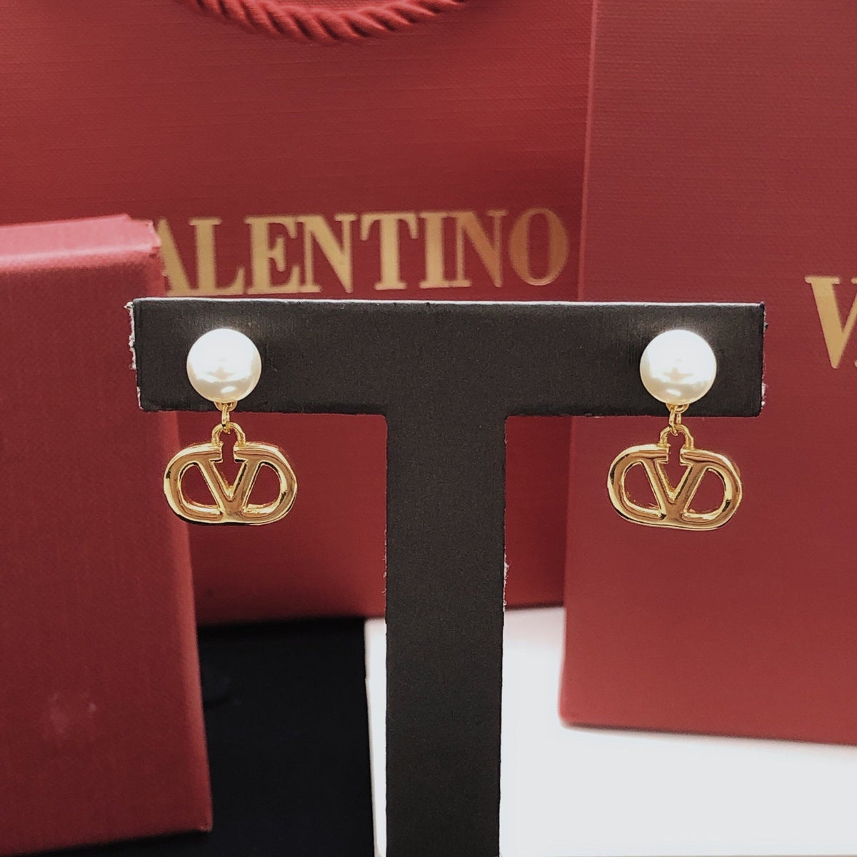Martin Graham stud earrings in polished metal-tone