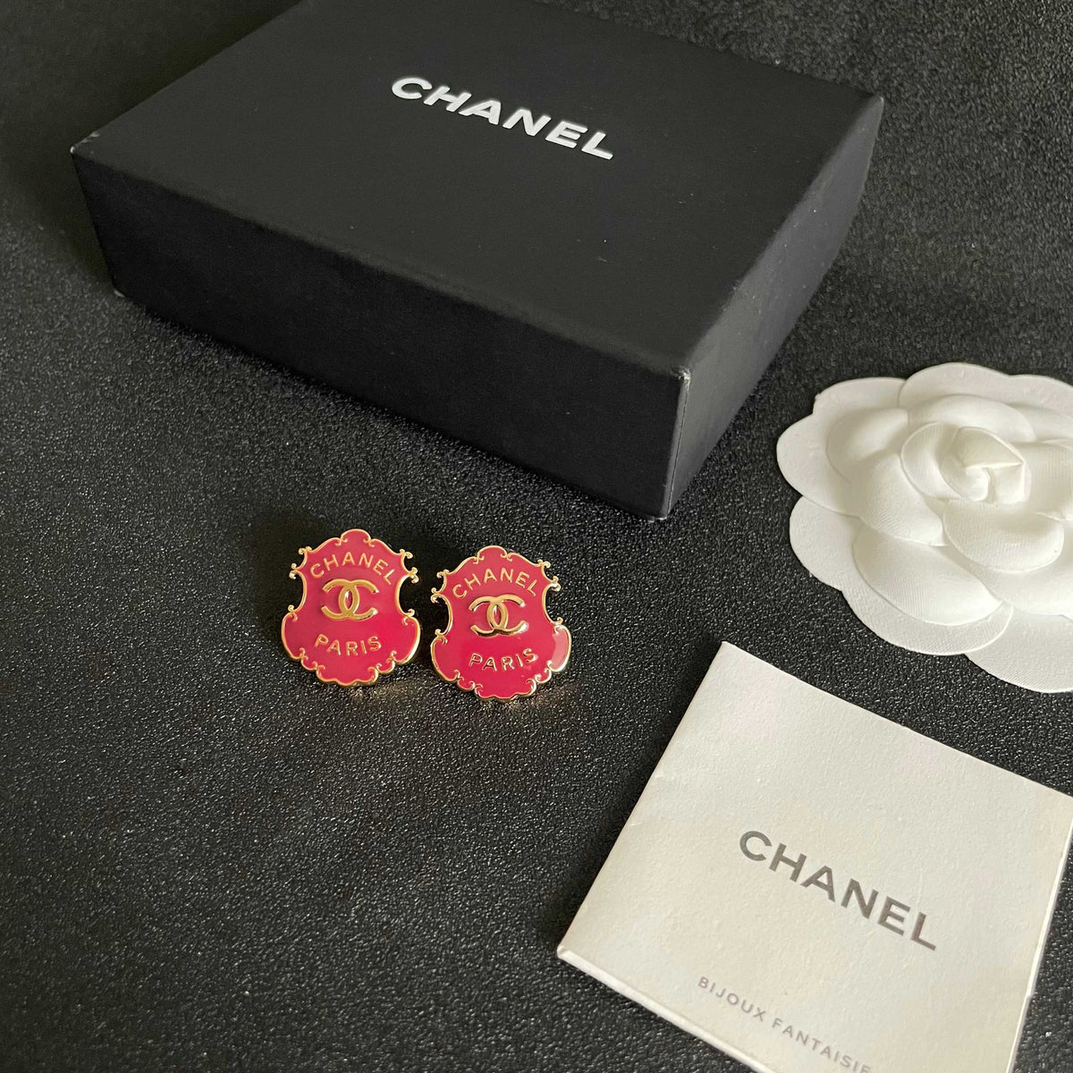 Martin Graham stud earrings in polished metal-tone – close-up detail