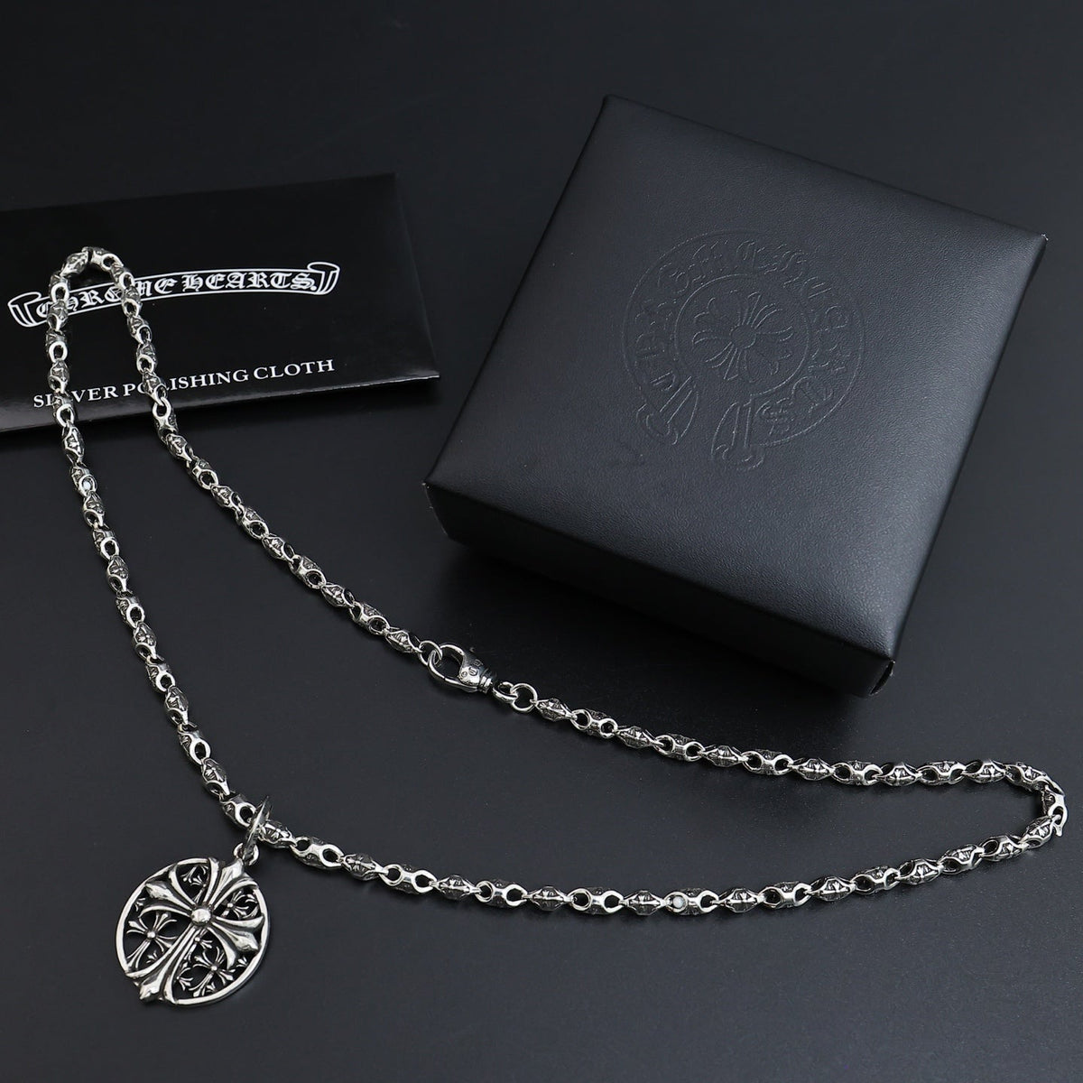 Martin Graham pendant necklace in polished metal-tone – close-up detail