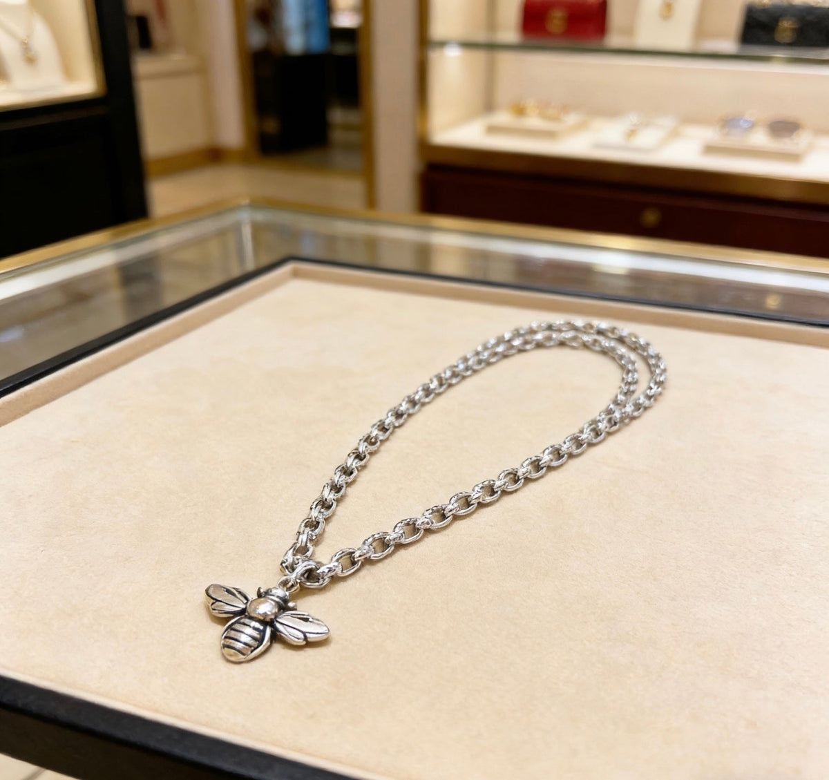 Martin Graham pendant necklace in polished metal-tone – close-up detail
