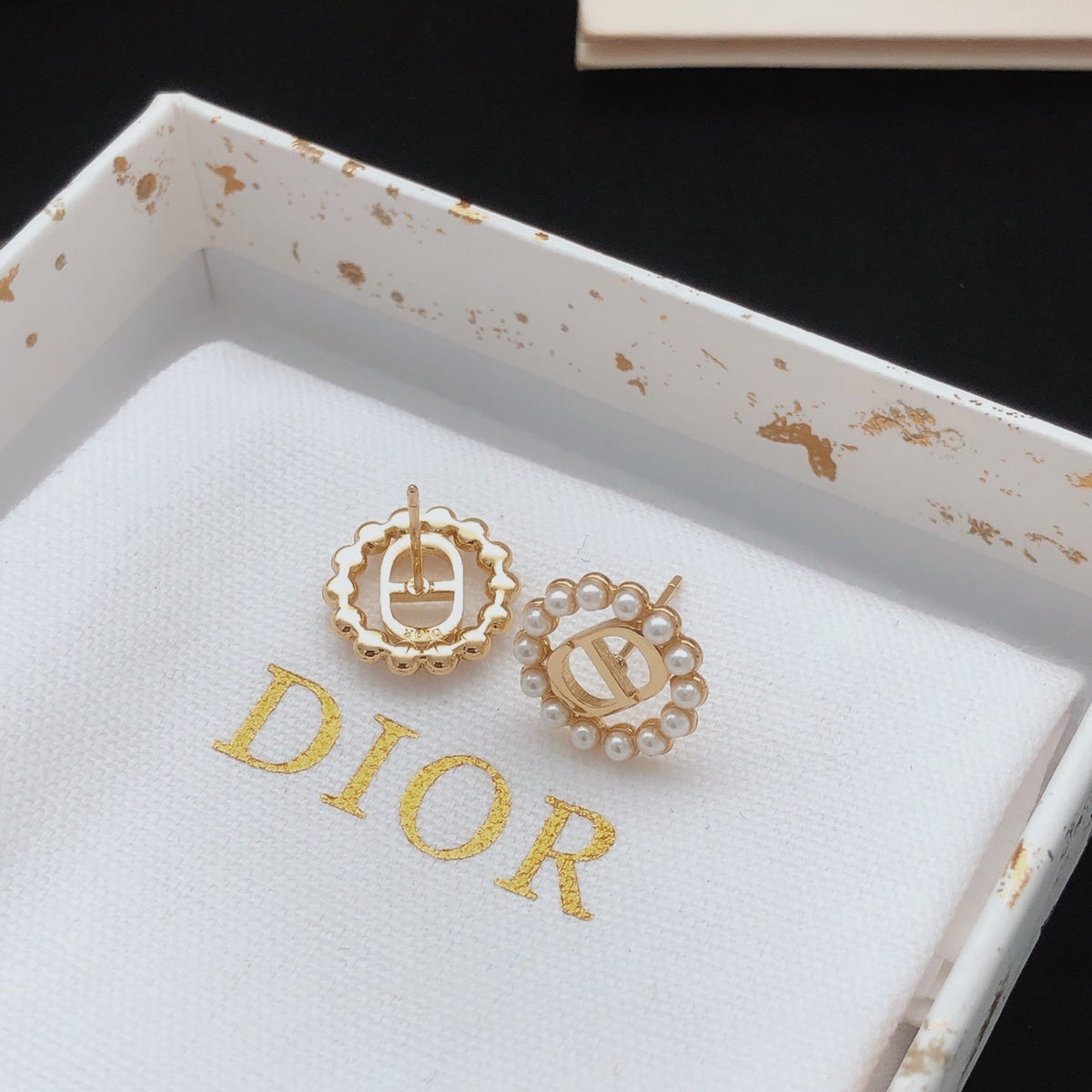 Martin Graham stud earrings in polished metal-tone