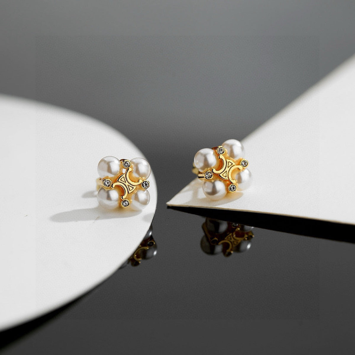 Martin Graham stud earrings in polished metal-tone