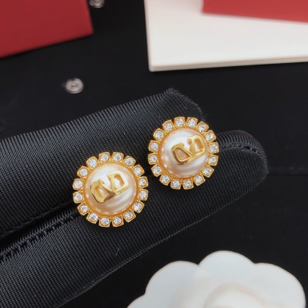 Martin Graham stud earrings in polished metal-tone
