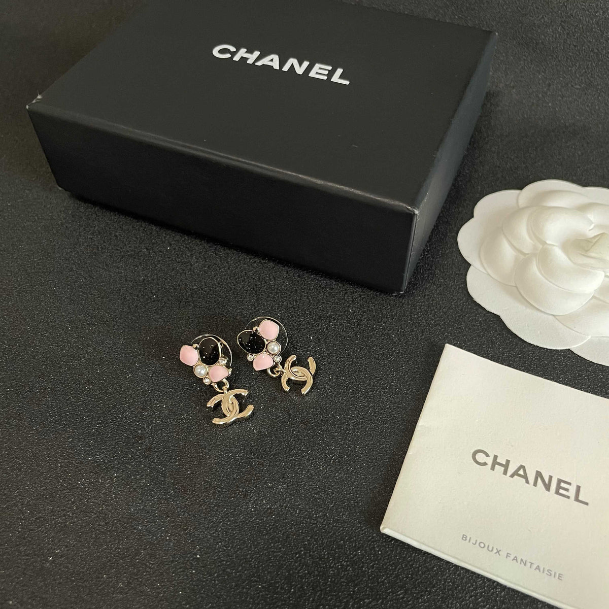 Martin Graham stud earrings in polished metal-tone – close-up detail