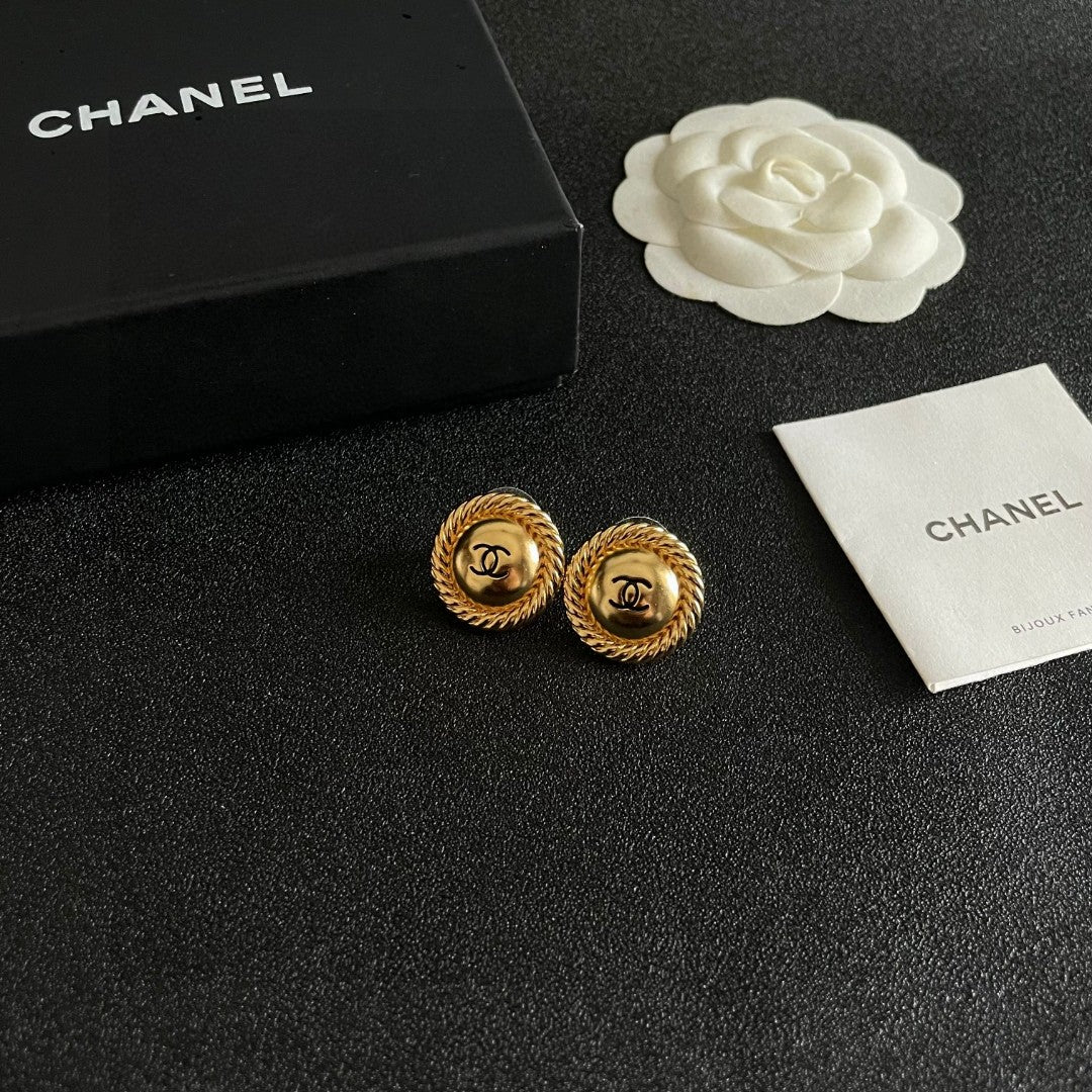 Martin Graham stud earrings in polished metal-tone – styled product view