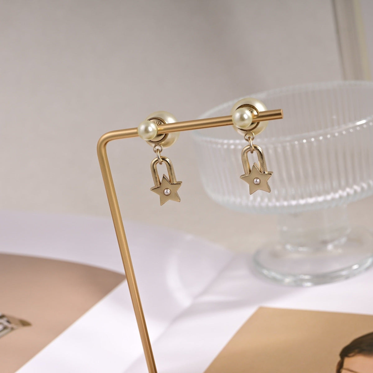 Martin Graham earrings in polished metal-tone – close-up detail
