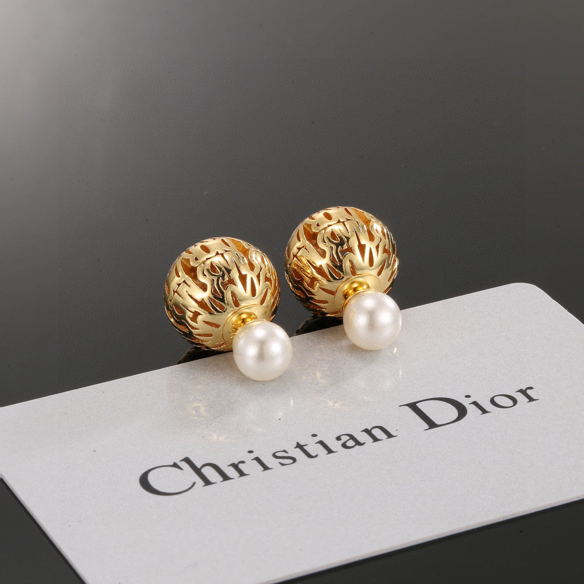 Martin Graham earrings in polished metal-tone – close-up detail
