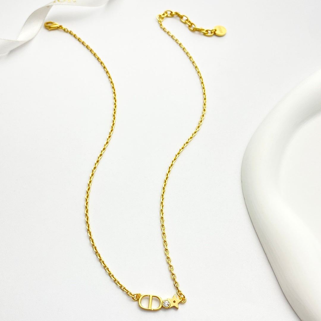 Martin Graham pendant necklace in polished metal-tone – close-up detail