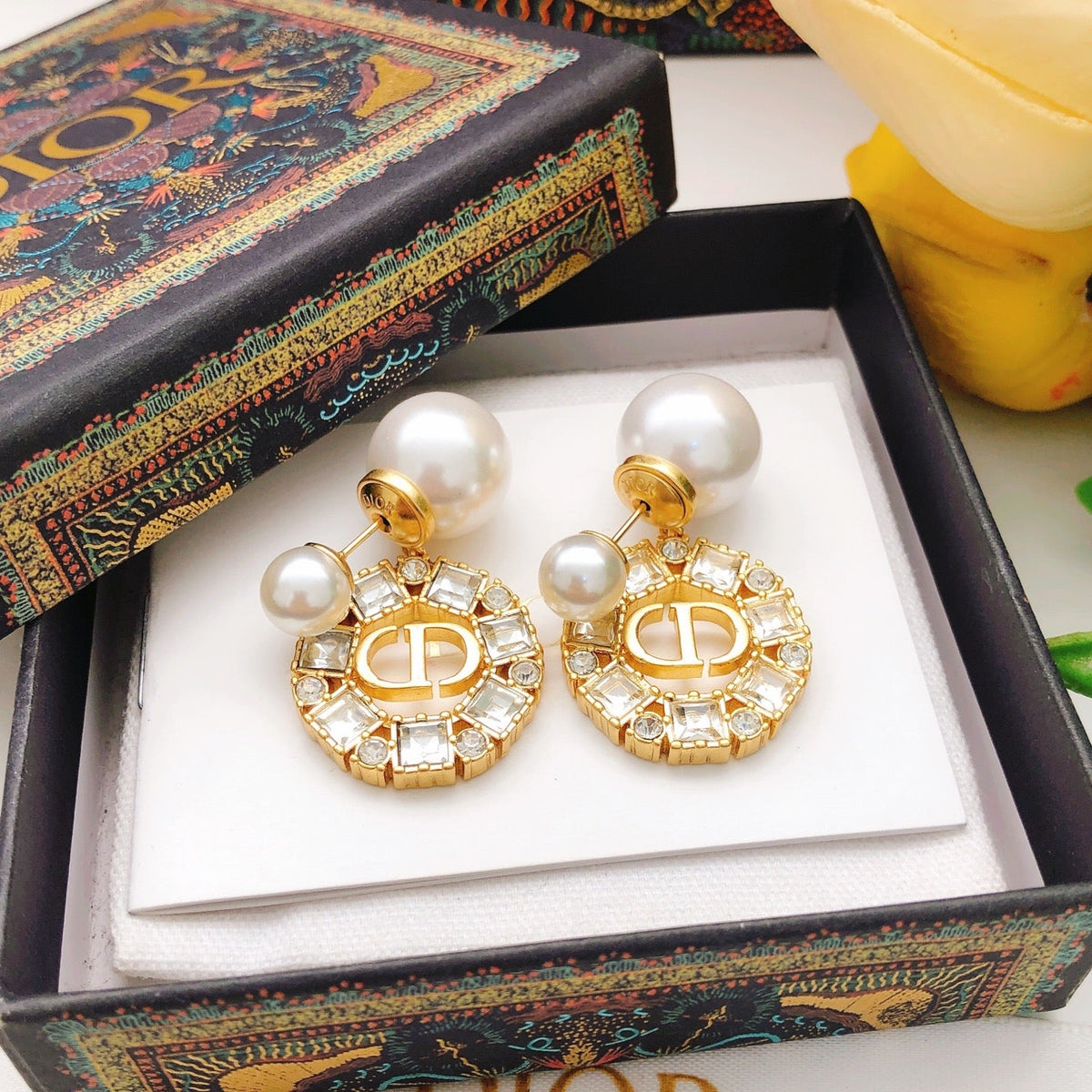 Martin Graham stud earrings in polished metal-tone – close-up detail