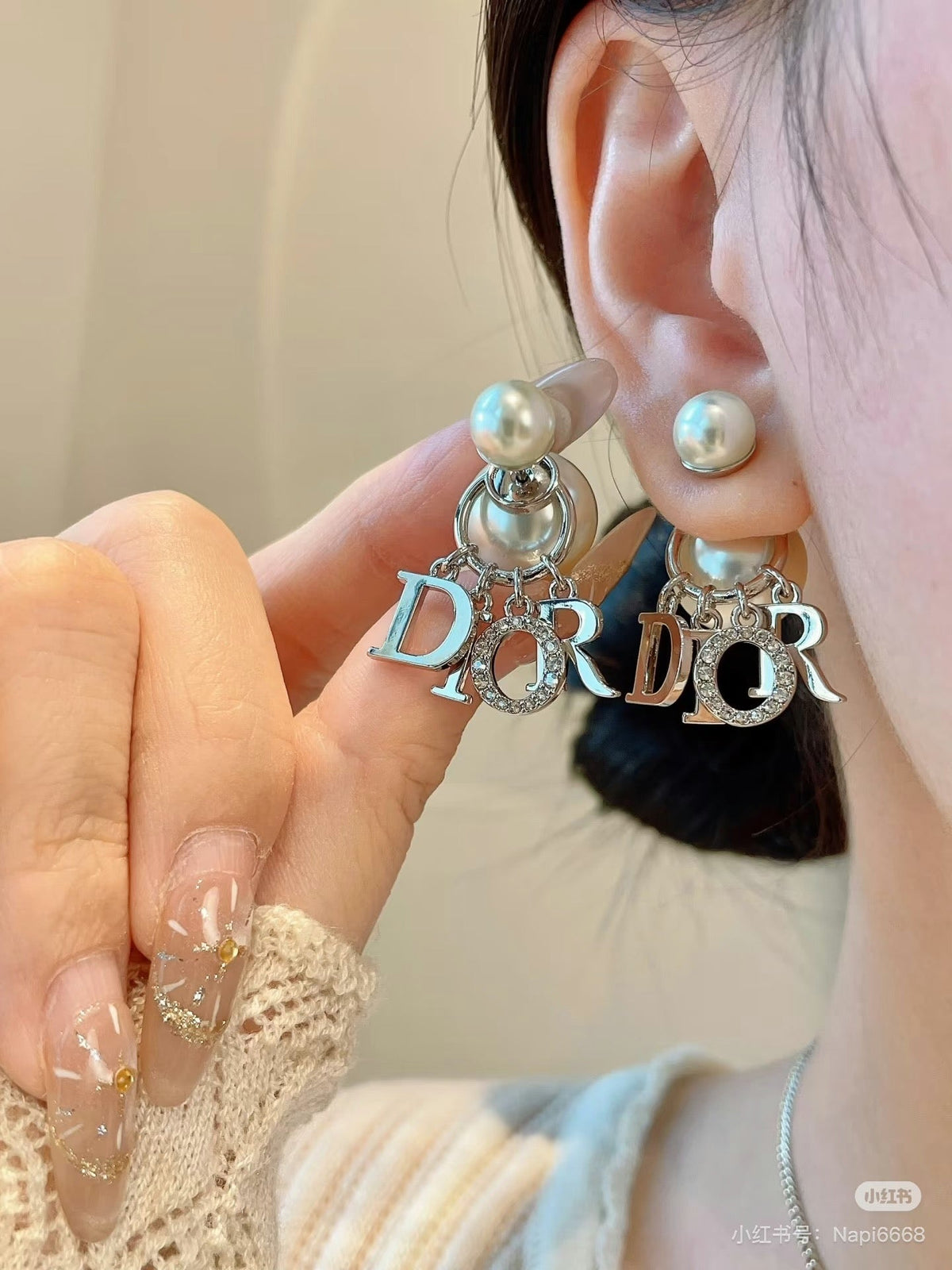 Martin Graham earrings in polished metal-tone – close-up detail