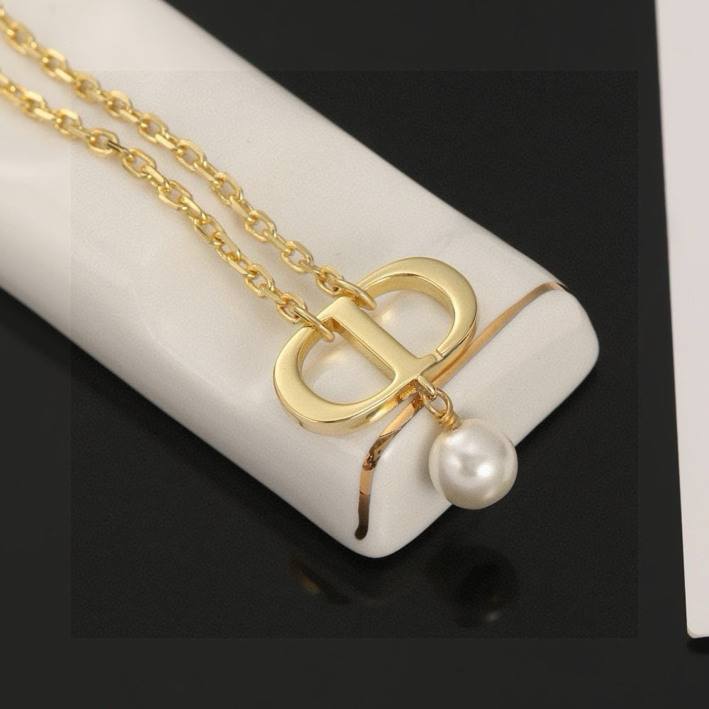 Martin Graham pendant necklace in polished metal-tone – close-up detail