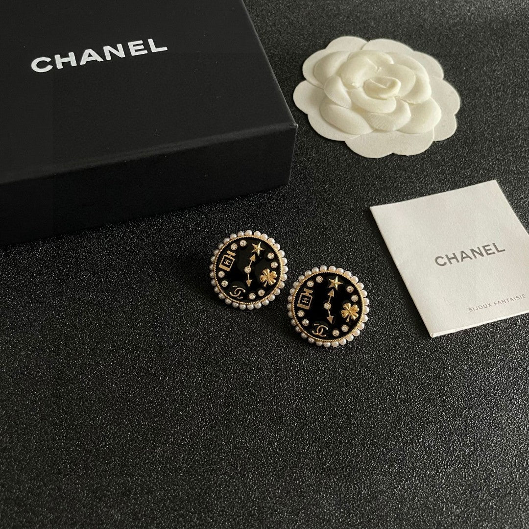 Martin Graham stud earrings in polished metal-tone – styled product view