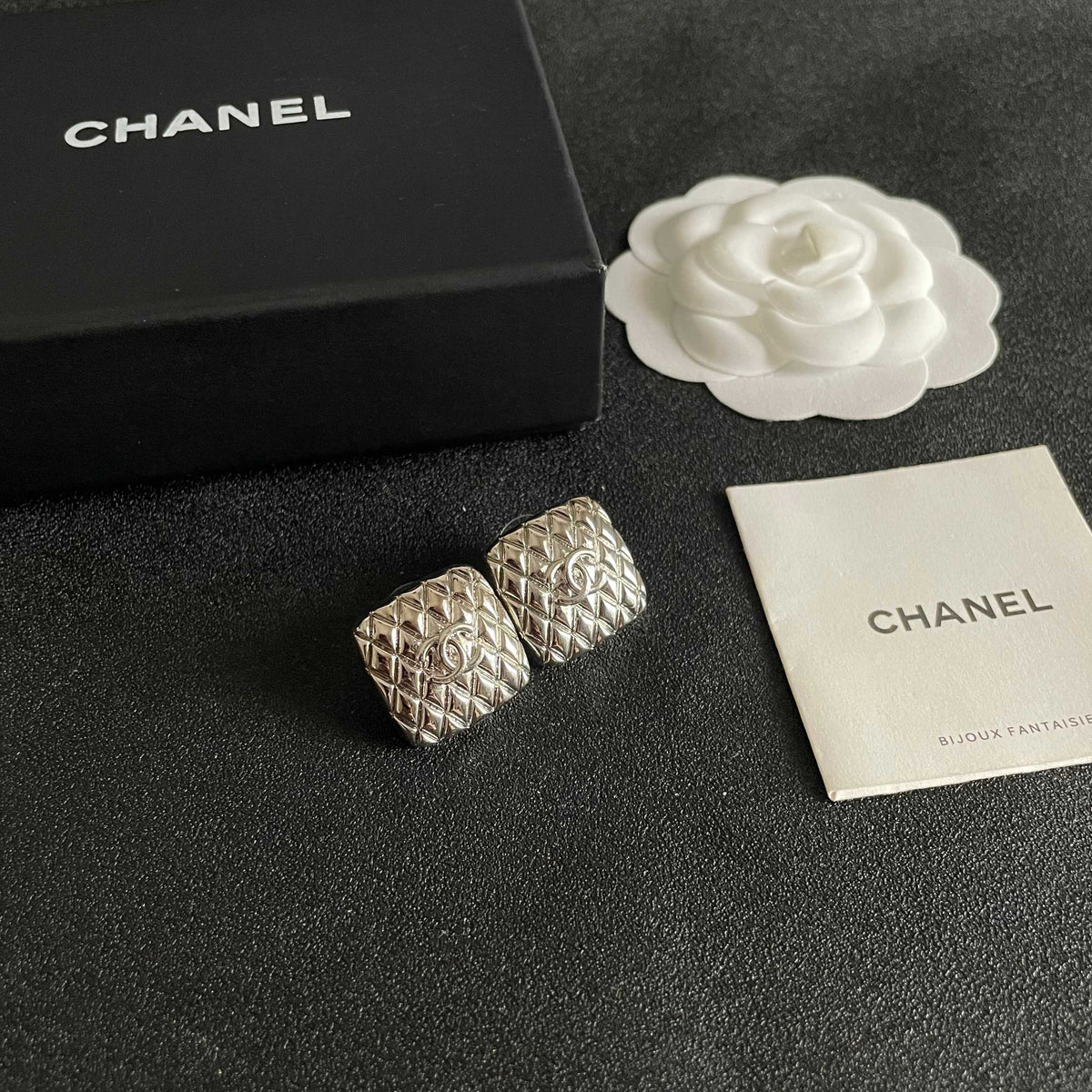 Martin Graham stud earrings in polished metal-tone – styled product view