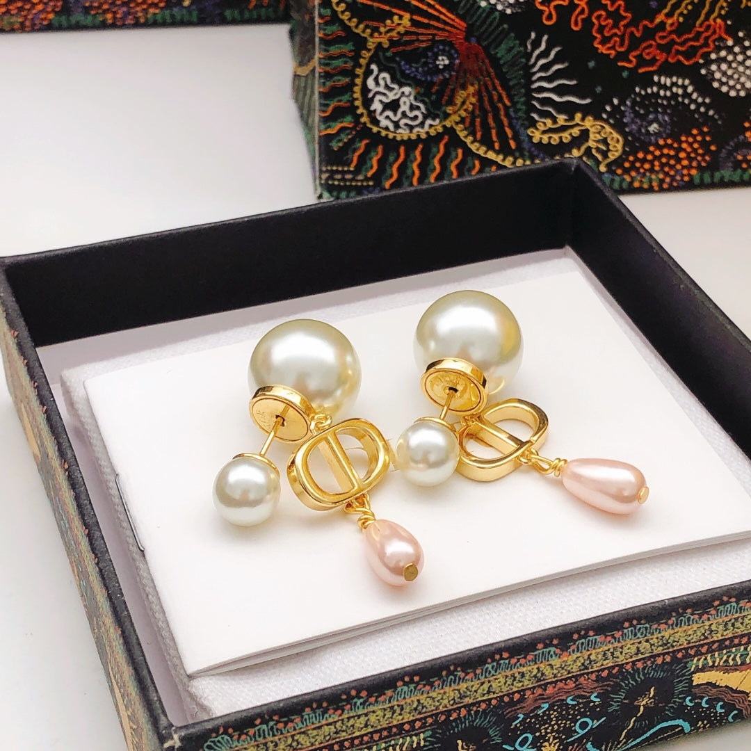 Martin Graham stud earrings in polished metal-tone – close-up detail