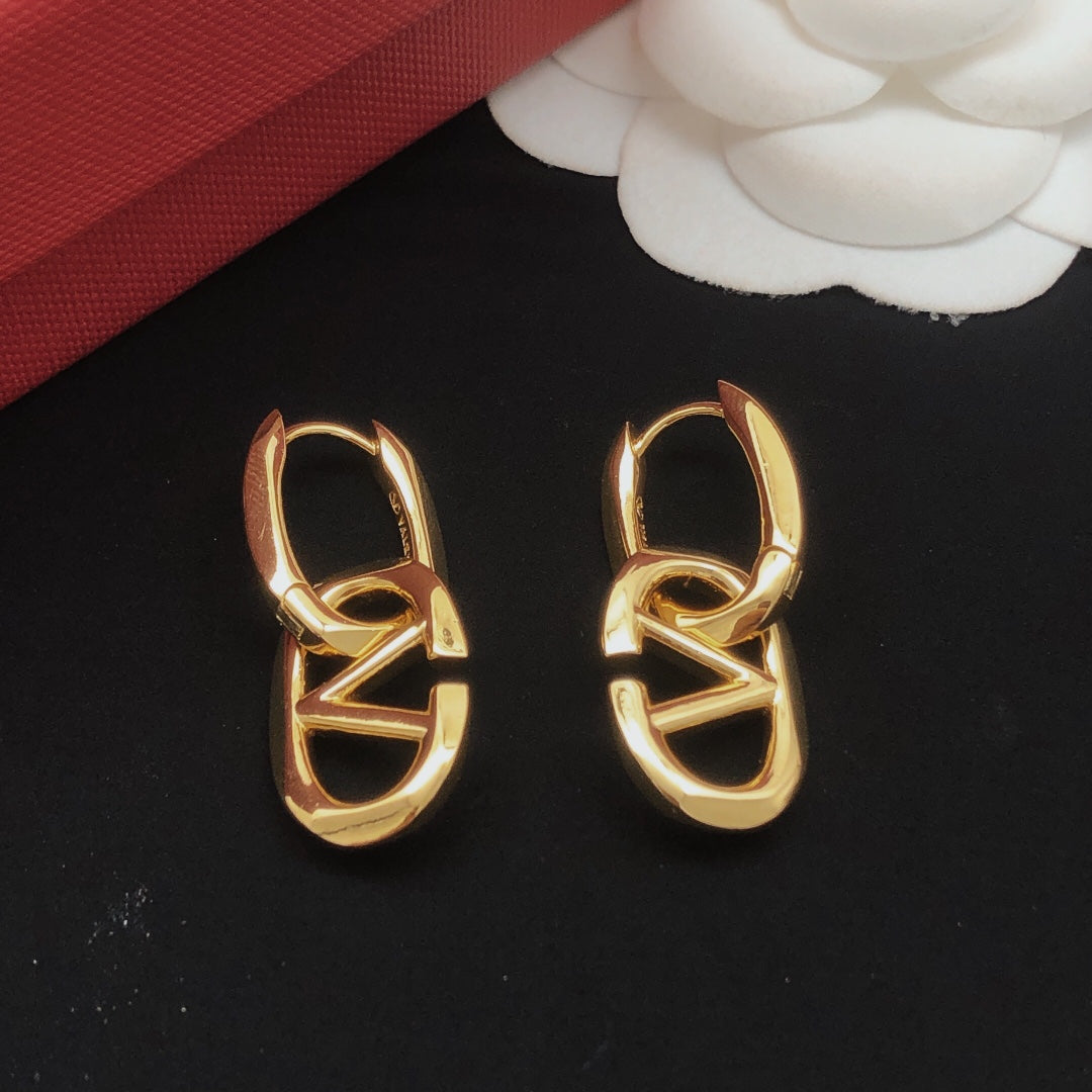 Martin Graham drop earrings in polished metal-tone