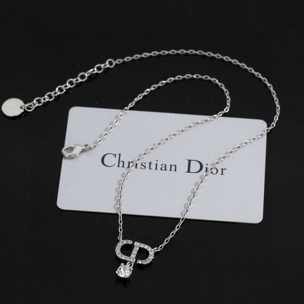 Martin Graham pendant necklace in polished metal-tone – close-up detail