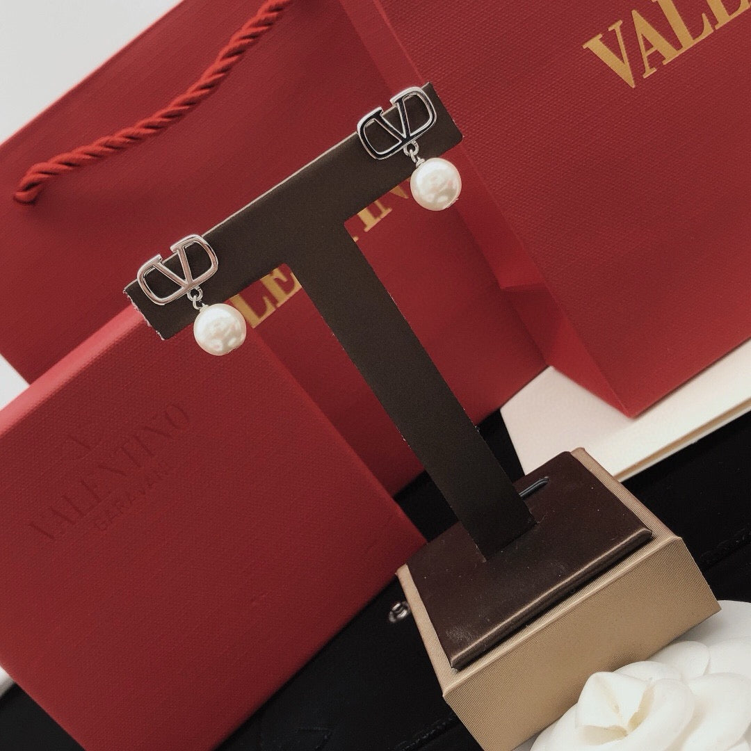 Martin Graham stud earrings in polished metal-tone