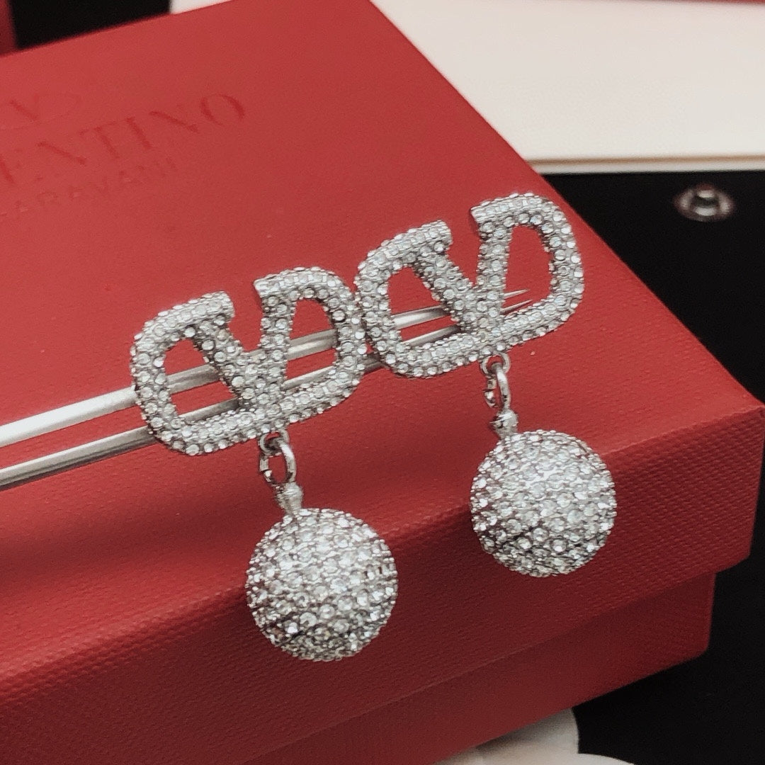 Martin Graham stud earrings in polished metal-tone